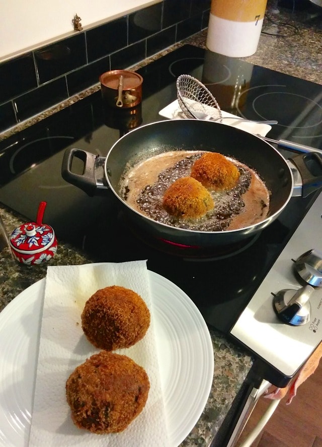 Scotch Eggs cooking in oil